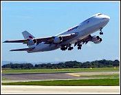 airplane safely taking off from airport runway